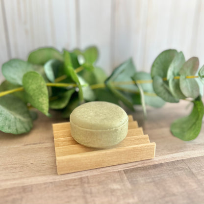 Shampoo bar for oily hair displayed on wooden tray